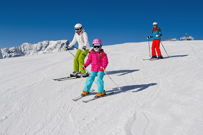 Skiing, winter, ski lesson - skiers on mountainside